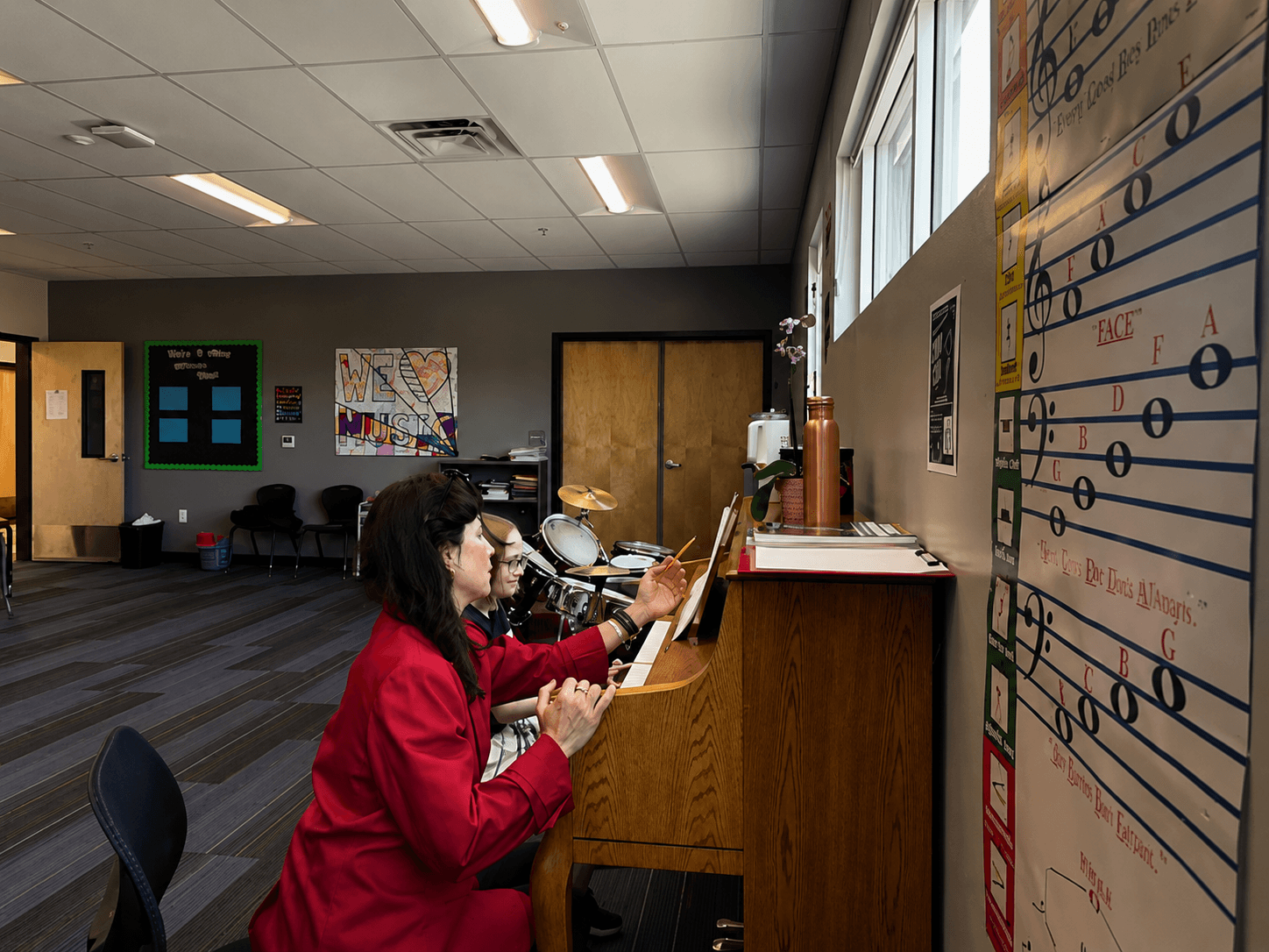 Elizabeth Sullivan teaching a student at the piano
